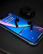 Image result for iPhone XR and AirPods