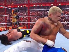 Image result for Cody Rhodes vs Seth Rollins HIAC Torn Kendo Stick On Torn PEC