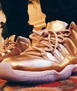 Image result for Nike Jordan Retro 11 Gold High