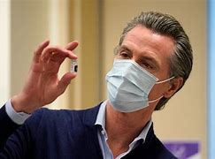 Image result for Photo of Gavin Newsom Making a Phone Call