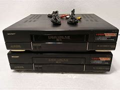 Image result for System Multi Sharp VHS Multiplayer Player