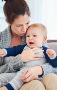 Image result for Mother Holding Crying Baby