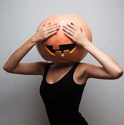 Image result for Wearing a Pumpkin as a Halloween Mask