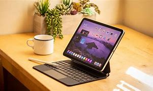 Image result for Space Gray iPad Pro with White Magic Keyboard