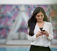 Image result for Woman Holding Phone Orange Shirt