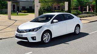 Image result for White Corolla Car