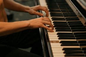 Image result for Person Playing a Piano