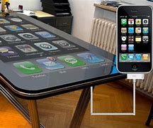 Image result for Apple iPhone On Table Inside Store