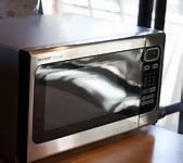 Image result for TBL Shooting Sharp Carousel Microwave Oven