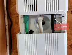 Image result for Small Plastic White Box That Says Reset Hold Button 5 Seconds