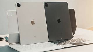 Image result for Space Grey iPad Pro with White Magic Keyboard