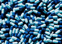 Image result for Blue Capsules Black Background