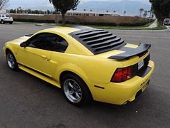 Image result for 2003 zinc yellow mach I