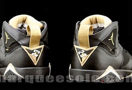Image result for Air Jordan 7 Black and Gold