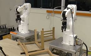 Image result for Robot Arms at Auto Factory