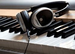 Image result for Piano and Headphones