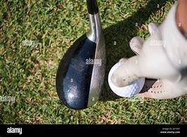 Image result for Golf Ball On Tee with Hill in Background