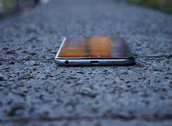 Image result for iPhone 6 Plus in Hand