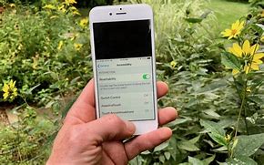 Image result for Apple iPhone in Black Hand