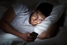 Image result for Guy Smiling On Phone in Bed