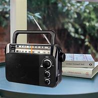 Image result for AM/FM Mini Portable Radio with Plug Inn
