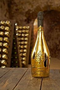 Image result for Champagne in a Gold Spiraled Bottle