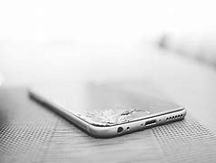 Image result for Cracked iPhone SE Front and Back On the Charger