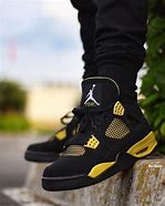 Image result for Air Jordan 4 Black Yellow