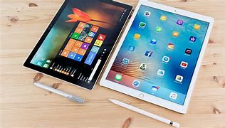 Image result for 2 in 1 Tablet vs Surface Pro