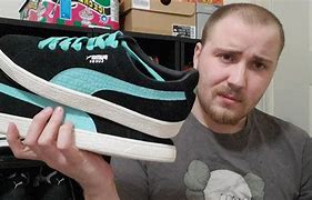 Image result for Puma Suede Black and Gold