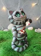 Image result for Creepy Cheshire Cat Statue