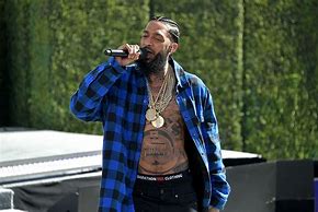 Image result for A Picture of Nipsey Doing Activist Work