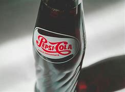 Image result for Pepsi and Coca-Cola Kissing
