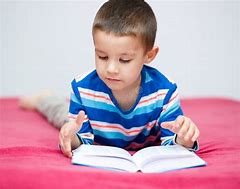 Image result for Little Boy Reading a Book Stock Photo