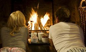 Image result for Couple Snuggling by Fire