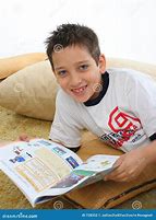 Image result for Little Boy Reading a Book On the Floor
