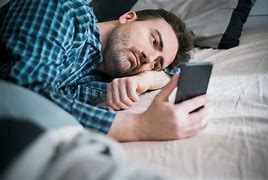 Image result for Person On Phone in Bed