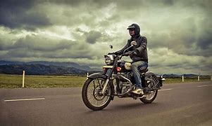Image result for A Man Riding a Motorcycle