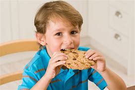 Image result for kid eating cookies and milk
