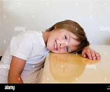 Image result for Child Laying On Table