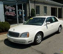 Image result for 04 White Cadillac DeVille On Flat Bed Truck