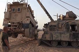 Image result for MRAP Next to a Tank
