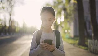 Image result for Kid Playing On Phone
