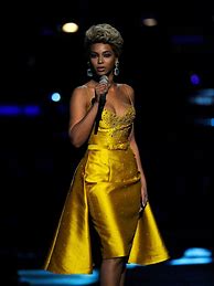Image result for Beyoncé in Yellow On Stage