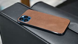 Image result for Nomad Brown Case On Blue iPhone 15 Pro