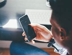 Image result for Person On Phone and Computer