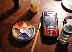 Image result for Red Cell Phone On a Table