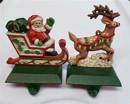 Image result for Santa and Reindeer Stocking Mantle Hangers