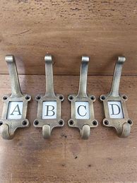 Image result for Antique Metal and Ceramic Coat Hooks