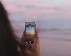 Image result for Girl Holding iPhone 13 Blue One